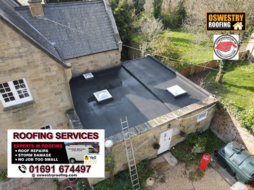 Rainwater gutter fitted beneath concrete roof tiles by Oswestry Roofing