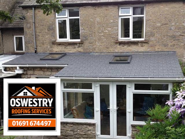 Completed red tiled pitched roof with hip ridge by Oswestry Roofing