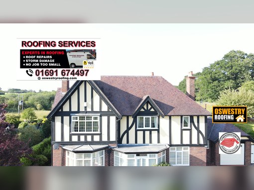 Oswestry Roofing Services Timber cladding and dark roofline trim fitted to a residential gable above a window for roofing work in Oswestry