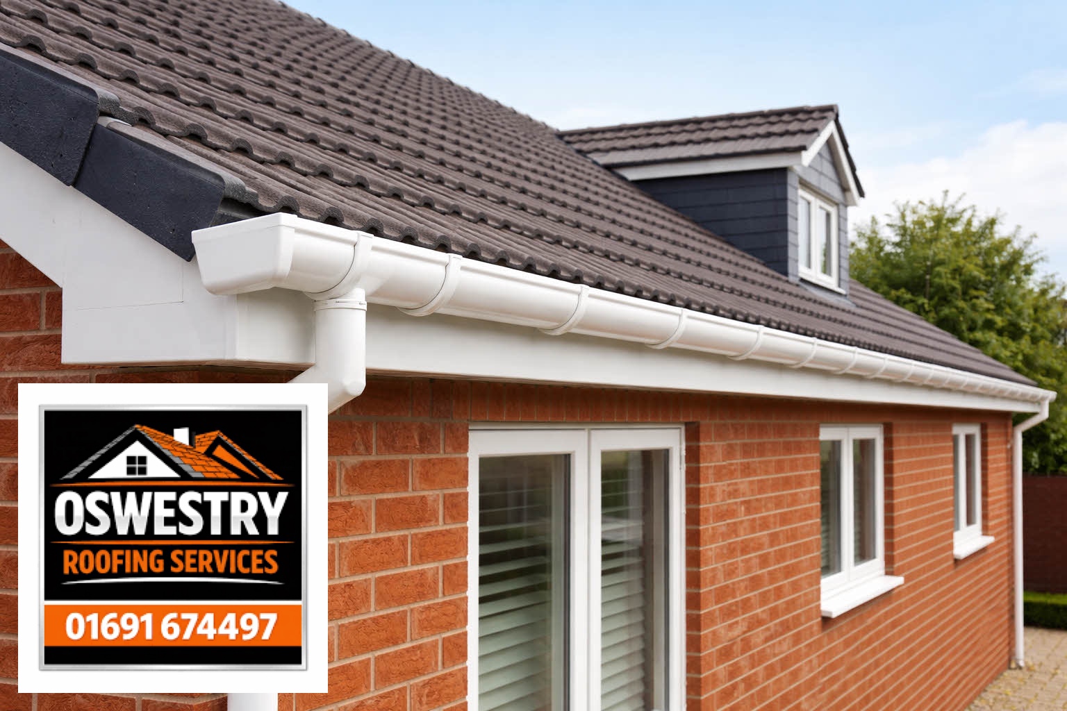 Oswestry Roofing Services White guttering and downpipe on a brick house
