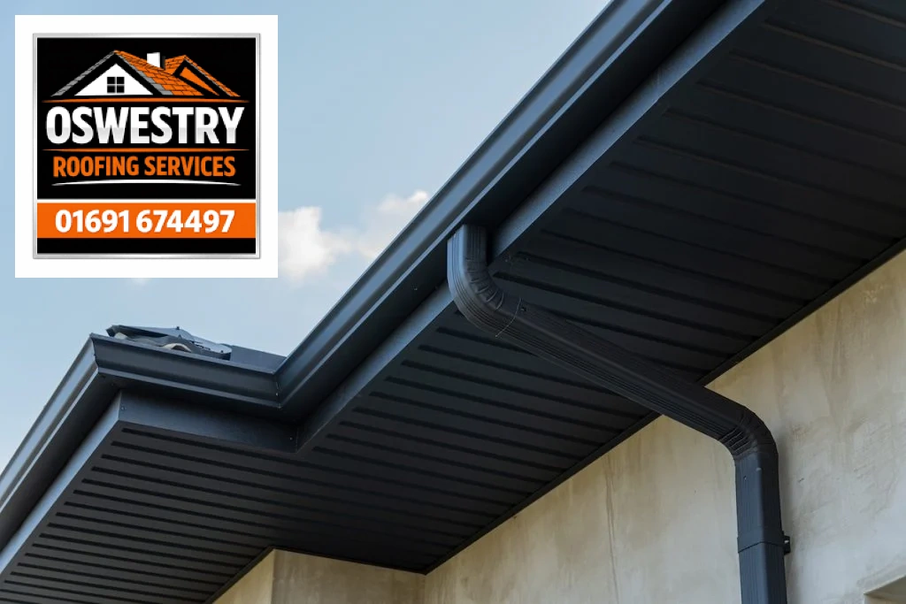 Oswestry Roofing Services Dark gutters, soffits and downpipe fitted beneath a roof