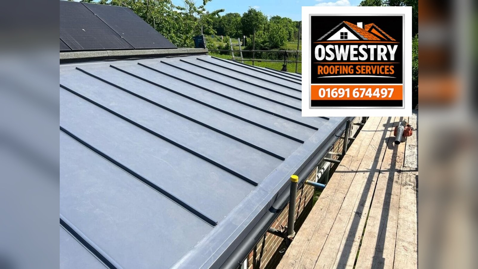 Completed natural slate replacement roof with roof window, leadwork and scaffolding for a property in Oswestry