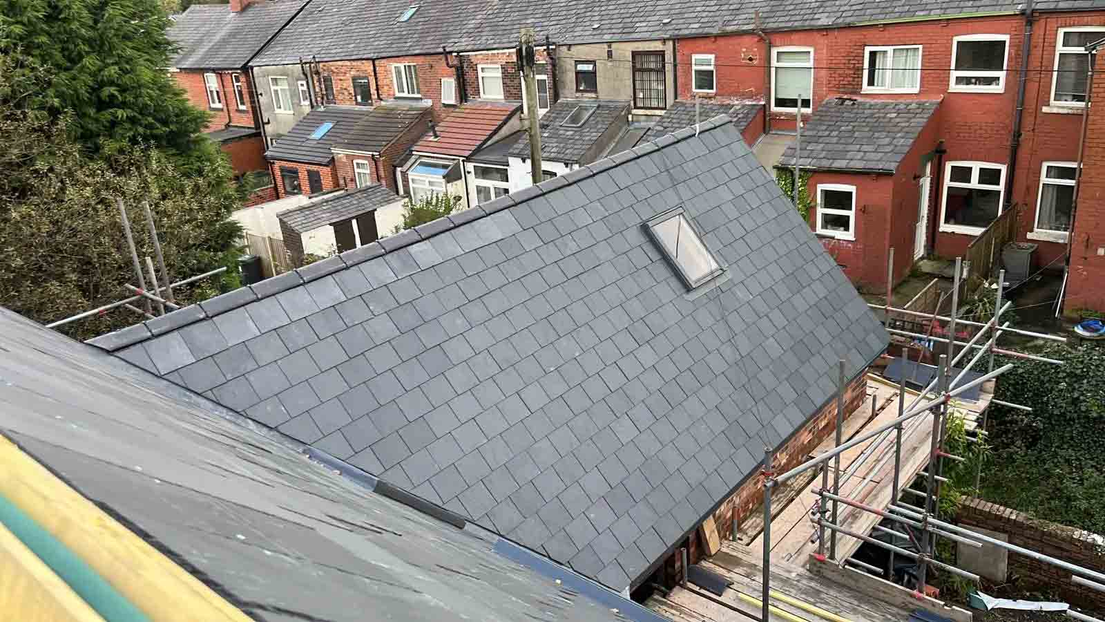 Oswestry Roofing Services Completed natural slate replacement roof with roof window, leadwork and scaffolding for a property in Oswestry